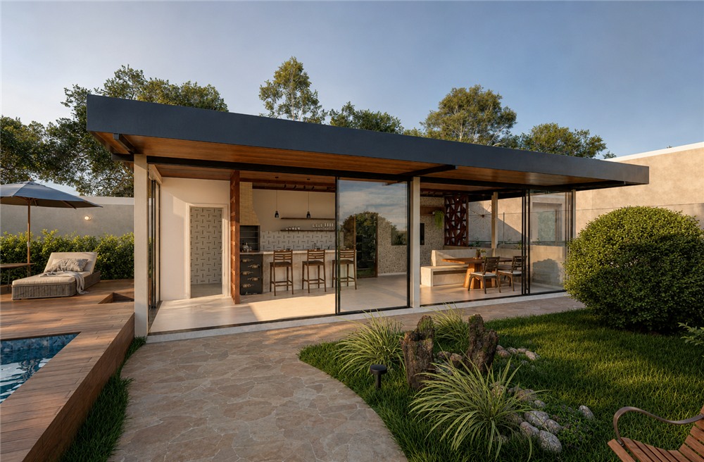 Pavilhão gourmet visto do jardim ao entardecer, com estrutura em vidro e cobertura em madeira.